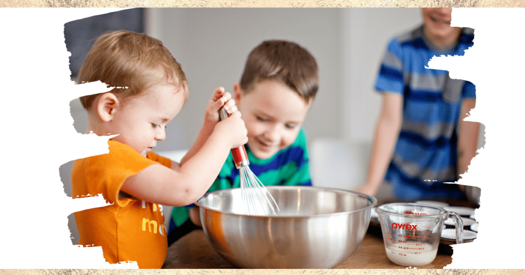 Little boys in kitchen mixing stuff in a big bowl.