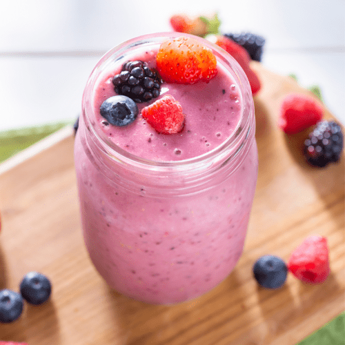 Berry smoothie in a mason jar.